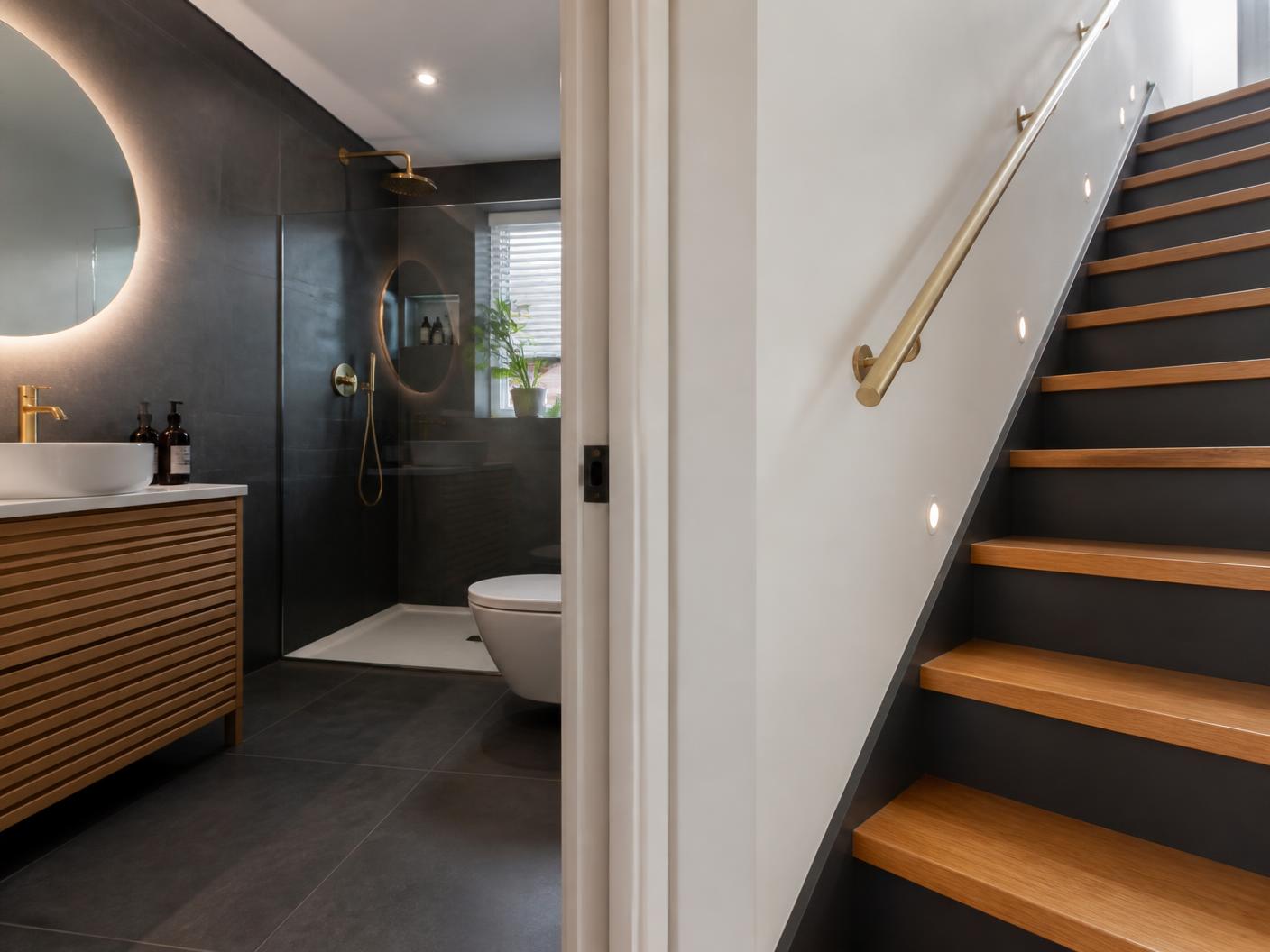 Refurbished bathroom and oak staircase in a modern home